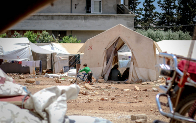 refugees in a temporary tent